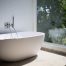 Bathtub facing Window with Outdoor View